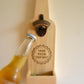 Hanging beer opener with cork catcher