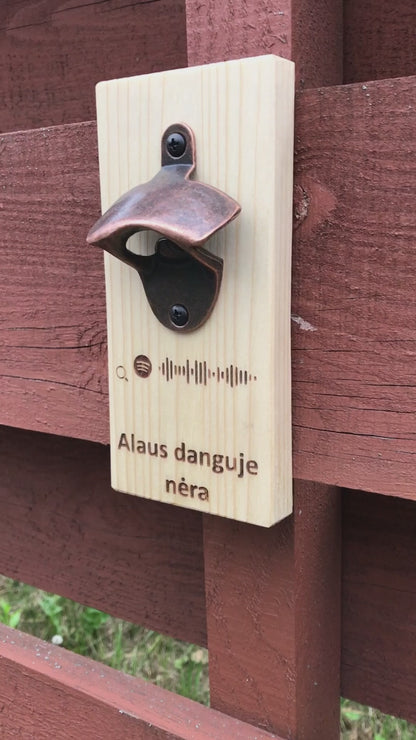 Hanging interactive magnetic beer opener
